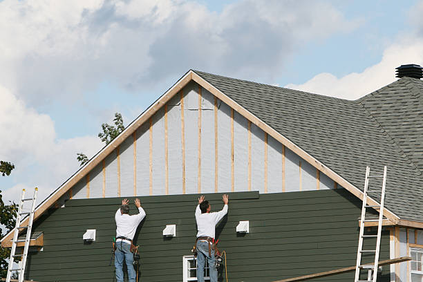 Professional Siding technician working in Lowell, MA